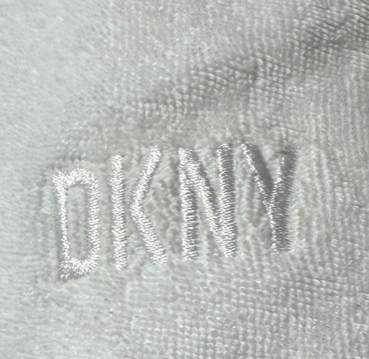 DKNY Sport Women's Terry Cloth Relaxed Shorts in white.
