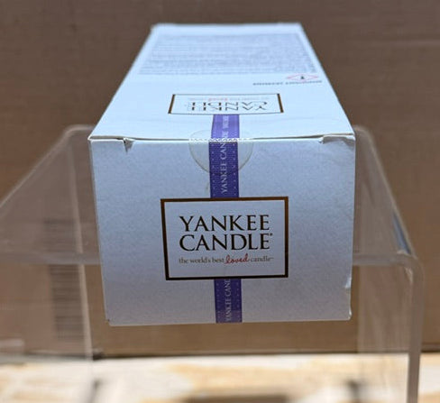 Close-up of Yankee Candle packaging highlighting brand name and design.
