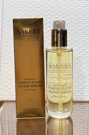Nakery SkinInfusion Power-Blend Serum Elixir in a clear bottle with a pump, displayed with its gold box.