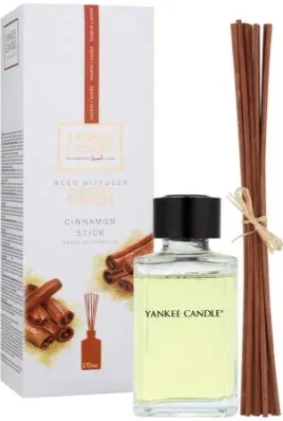 Yankee Candle reed diffuser with cinnamon stick scent, 5.75oz bottle and reed sticks displayed with packaging.