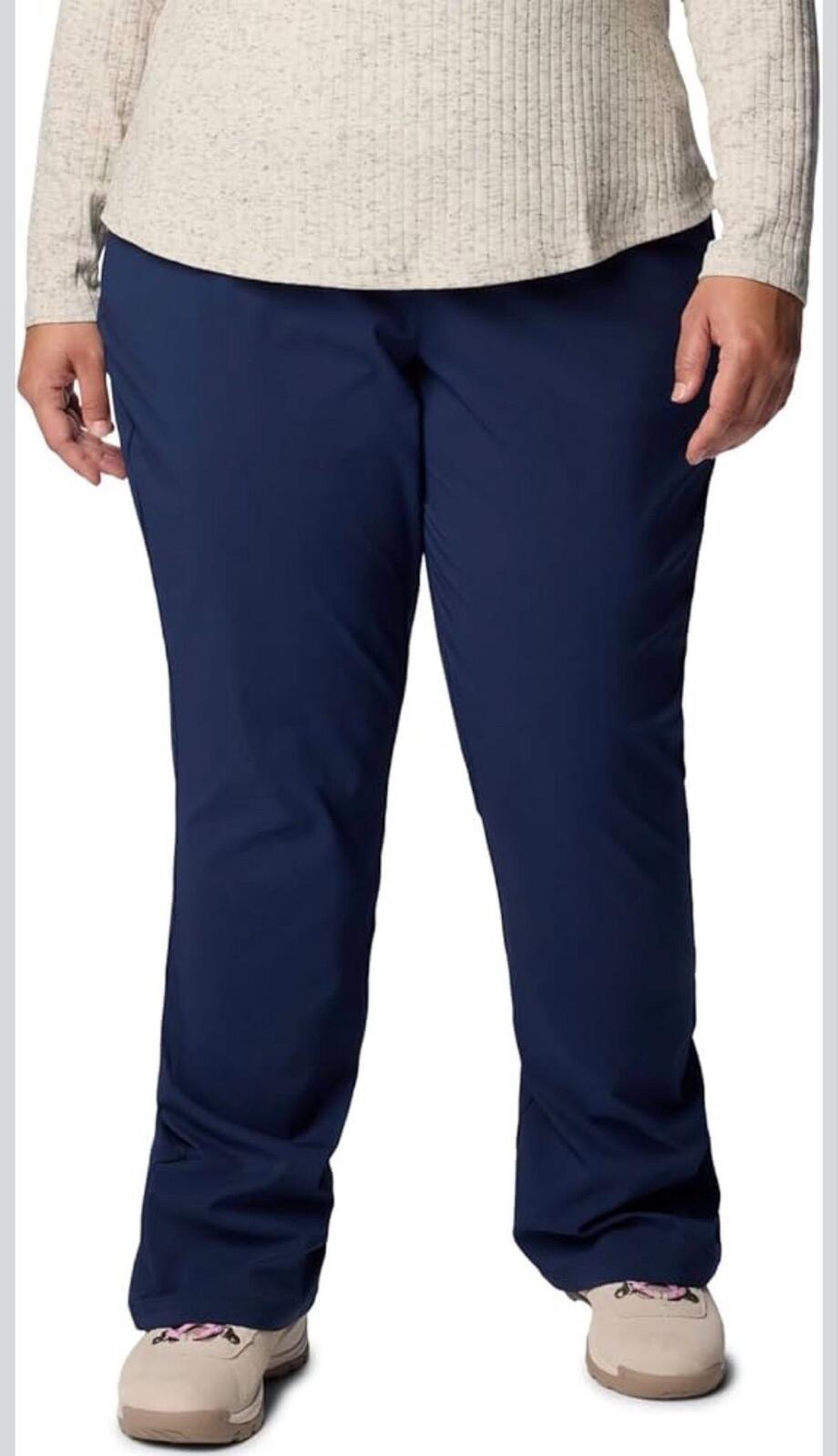 Columbia Women’s All Seasons Bootcut Pants in the "Nocturnal" (navy blue) colorway.